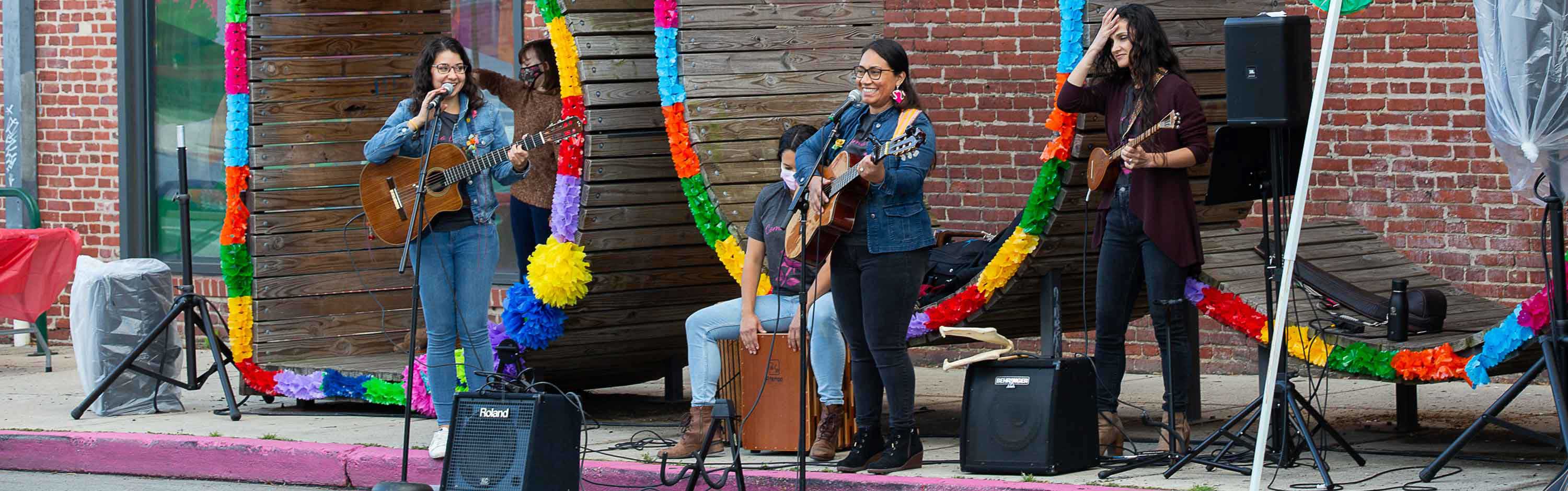 Musicians performing at bus stop on East Ave.